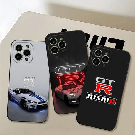 two iphone cases with the logo of a car