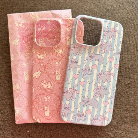 Two iphone cases with a pink and blue pattern