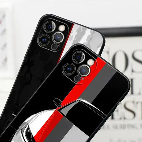 Two iphone cases with a red and black stripe