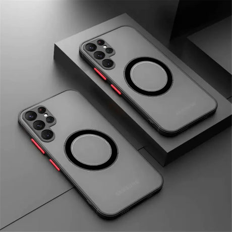 Two iphone cases with a red light on them