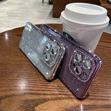 two iphone cases sitting on top of a table
