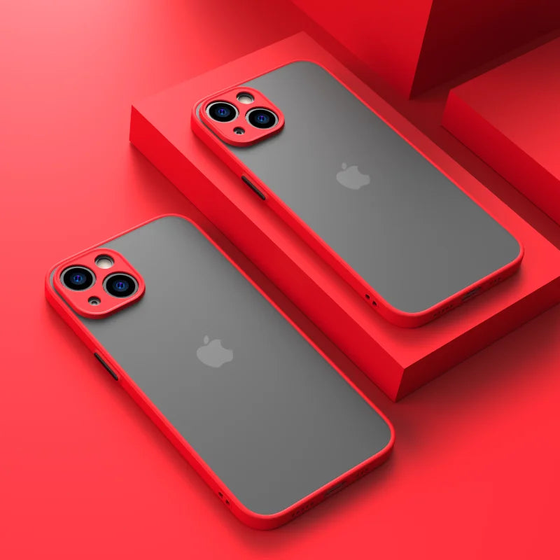 Two iPhone models with red camera bumpers and edges on a red surface.