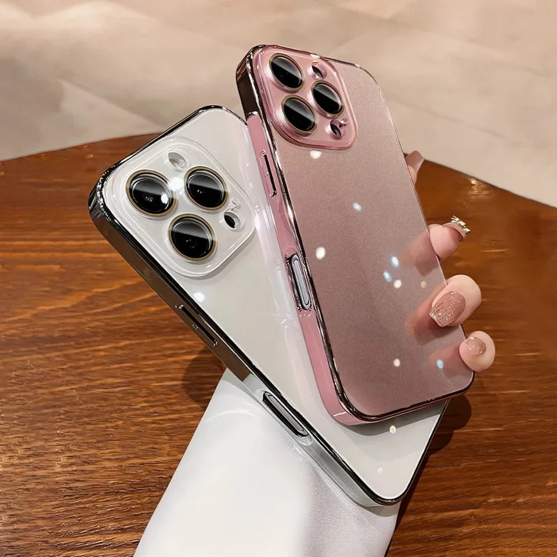 Two iPhones in clear protective cases, one with a silver frame and the other with a pink frame.