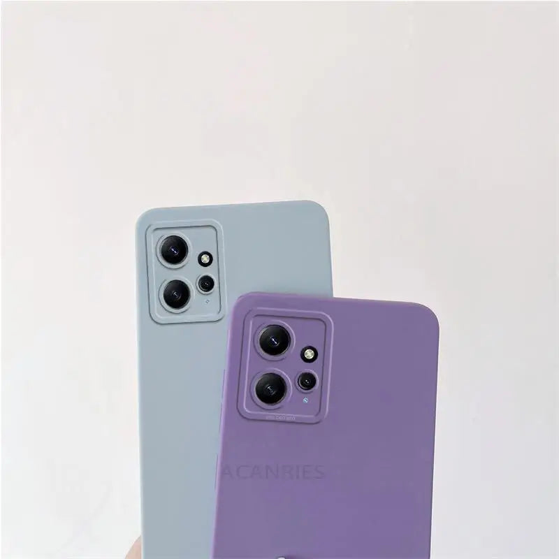 two iphones with purple and blue cases