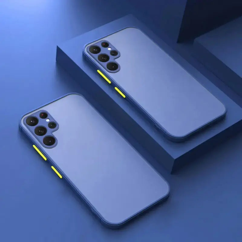 two iphones with yellow light on them