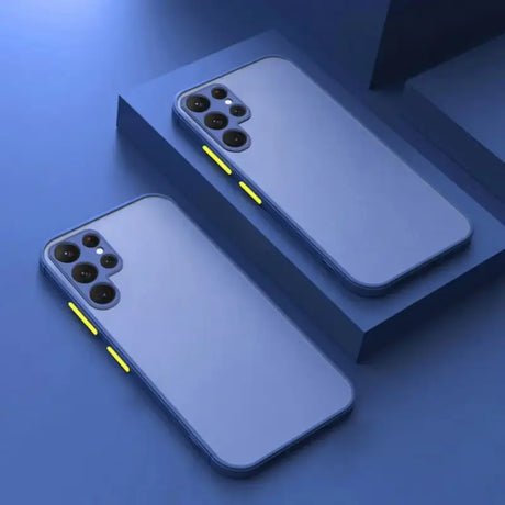 Two iphones with yellow light on them