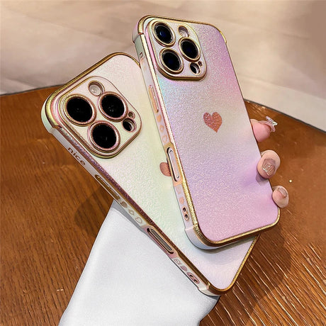 Two iridescent phone cases with gold trim.