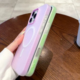 Two pastel-colored phone cases, one purple and one green, with magnetic charging rings and camera cutouts.