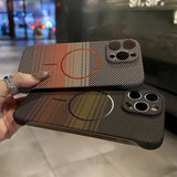 Two patterned smartphone cases, one with a reddish-orange stripe and the other with a brown-green stripe, both featuring a checkered design and a circular magnetic charging area.
