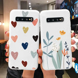 two phone cases with hearts and flowers