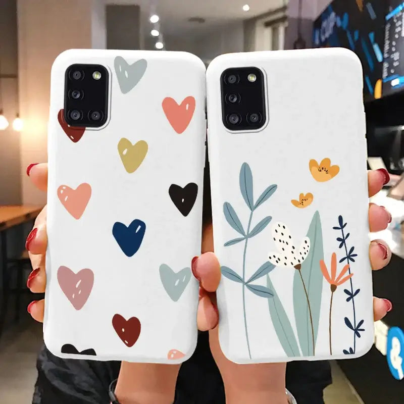 two phone cases with hearts and flowers