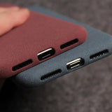 Two phone cases with port cutouts.