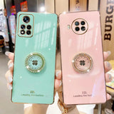 two phone cases with a phone ring on the back