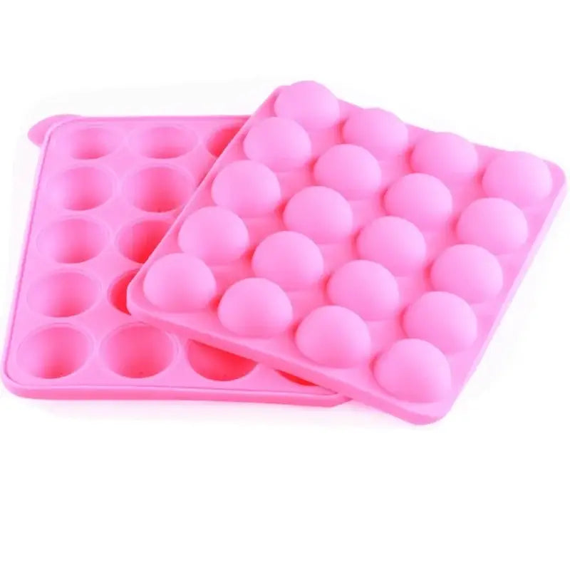 two pink plastic egg trays with eggs inside