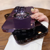 Two purple and black phone cases with a circular magnetic ring stand.