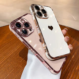 Two rose gold and white iPhone cases with heart designs.