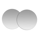 two round mirrors with a white background