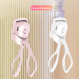 there are two scissors hanging on a wall next to a toothbrush