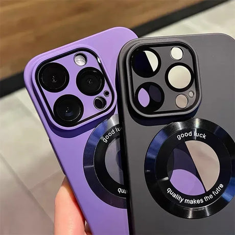 Two silicone phone cases, one purple and one dark gray, each with a camera lens protector and a circular magnetic accessory.