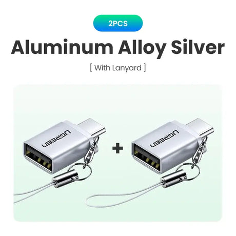 Two silver colored cables connected to a silver colored cable