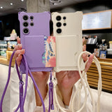 Two smartphone cases with attached lanyards and cardholders, one purple and one cream.