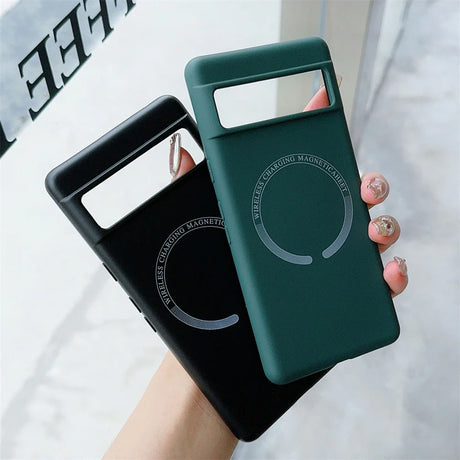 Two smartphone cases, one black and one green, with circular designs on the back.