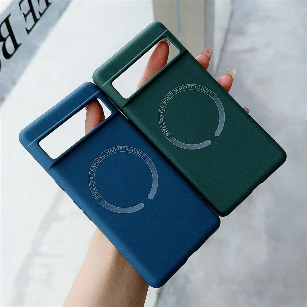 Two smartphone cases, one blue and one green, with circular designs on the back.