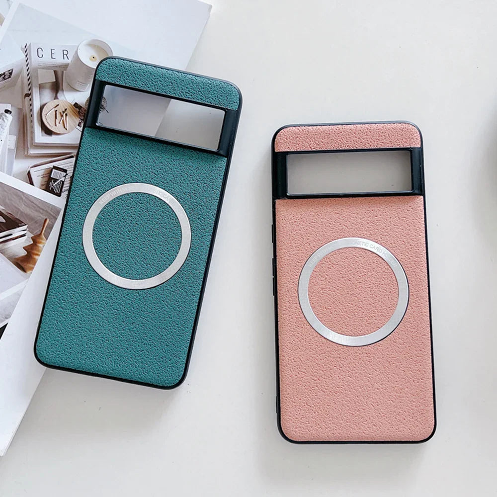 Two smartphone cases with circular designs, one teal and one pink.