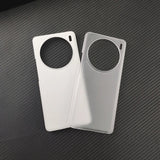 Two smartphone cases with circular camera cutouts, one white and one silver.