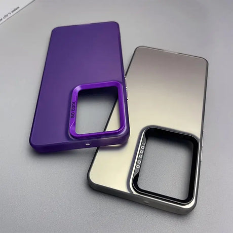 Two smartphone cases, one purple and one metallic silver, with cutouts for camera lenses.