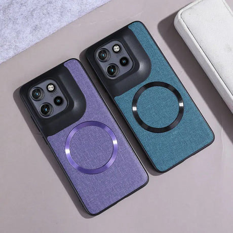 Two smartphone cases, one purple and one teal, with integrated camera cutouts and a circular magnetic ring.