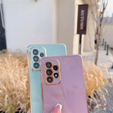 Two smartphones with multiple camera lenses, one in light blue and one in lavender color.