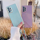 Two smartphones with pastel-colored cases and multiple camera lenses.