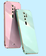 Two smartphones in pastel pink and mint green colors with multiple camera lenses.