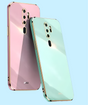 Two smartphones in pastel pink and mint green colors with multiple camera lenses.