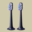 two toothbrushs with blue and white toothbrushs