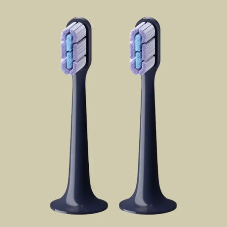 two toothbrushs with blue and white toothbrushs