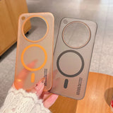 Two transparent phone cases, one orange-tinted and one gray-tinted, featuring circular cutouts and magnetic rings for wireless charging.