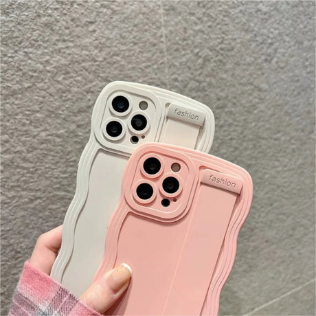 Two wavy-edged phone cases.