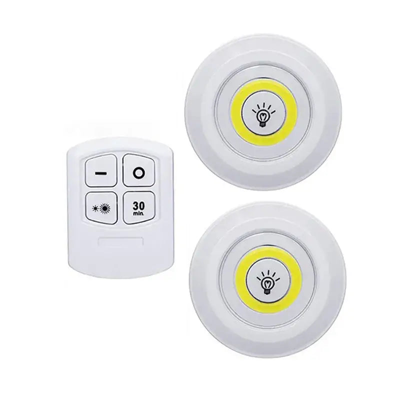 two white light switches with yellow light