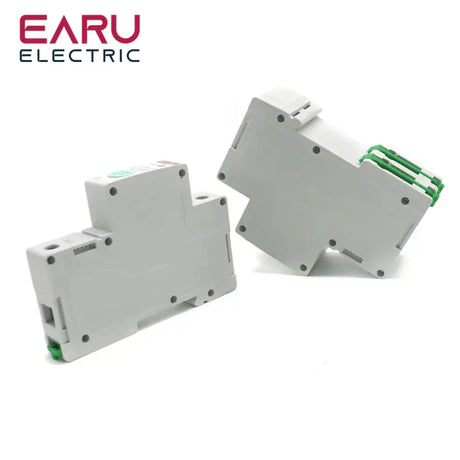 Two white plastic electrical switches with green handles