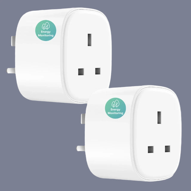 two white plugs with green stickers on them sitting next to each other