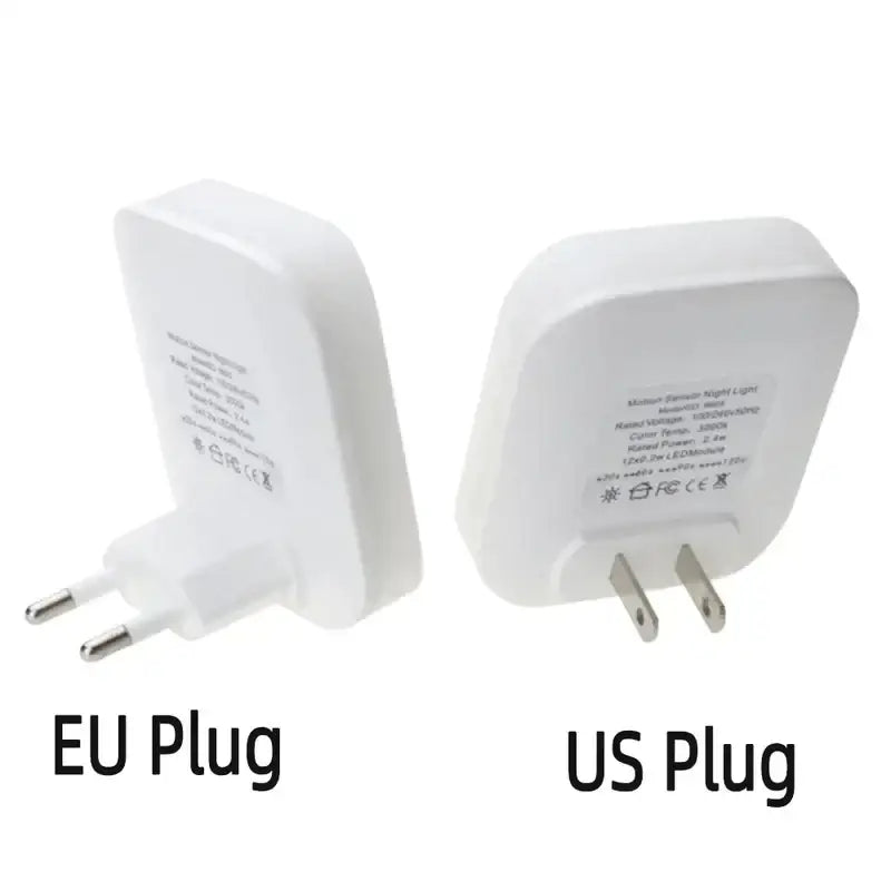 two white plugs with the words eu and us