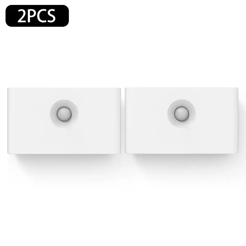 two white square switches on a white wall