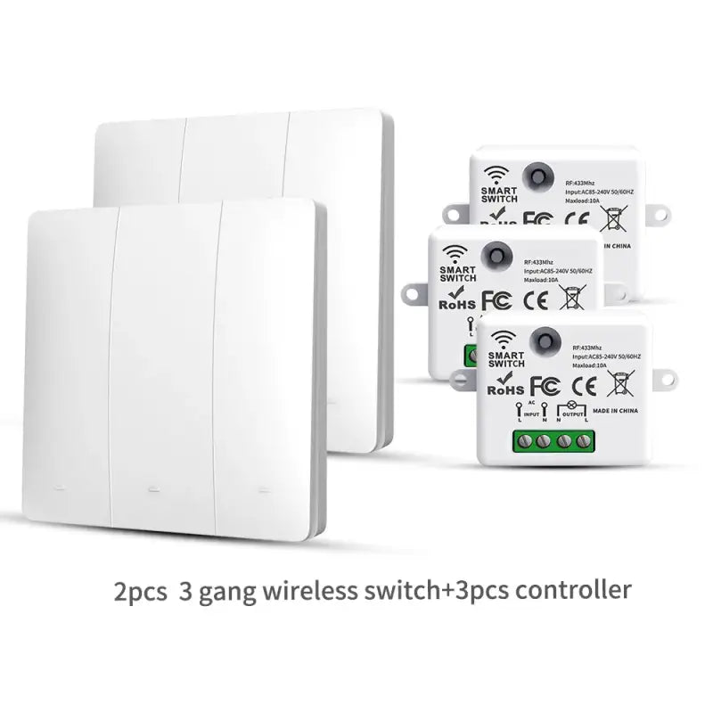 two white switches and a remote control unit on a white background