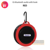 a red bluetooth speaker with hook on a white background