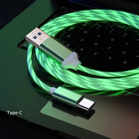 a green usb cable connected to a laptop