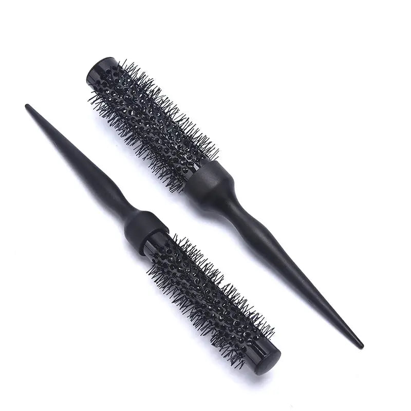 two brushes with black bristles on a white background