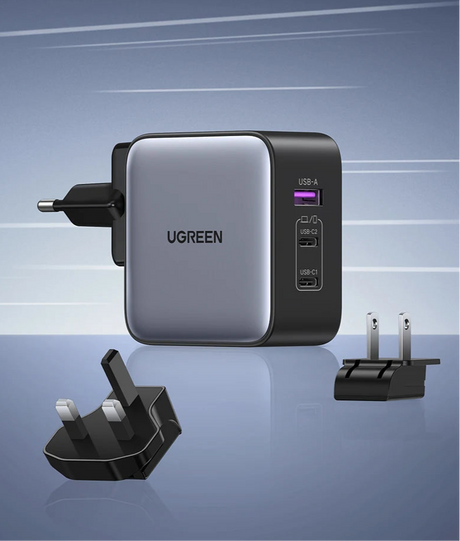 UGREEN multi-port USB charger with interchangeable plug adapters.