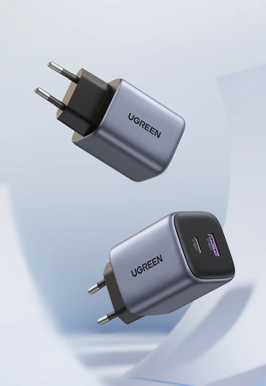 UGREEN USB wall chargers with dual ports in a metallic gray finish.